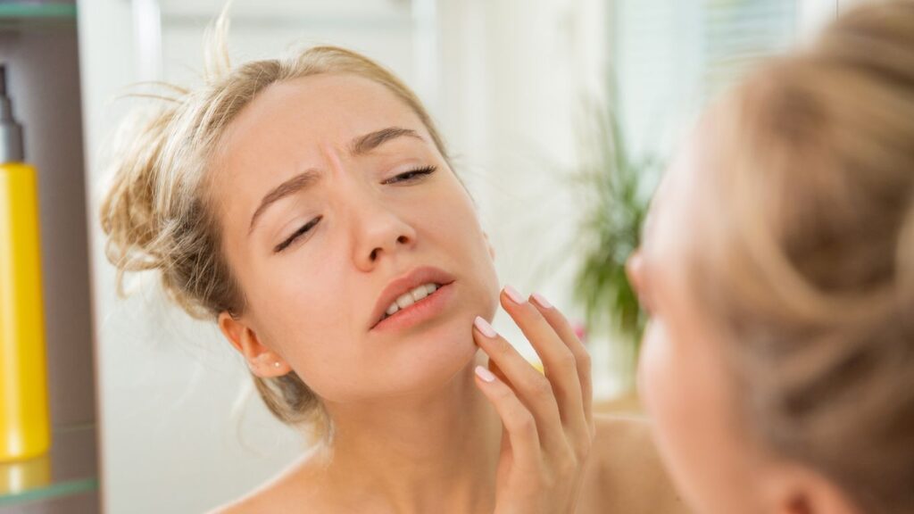 woman wondering why her skin is dry