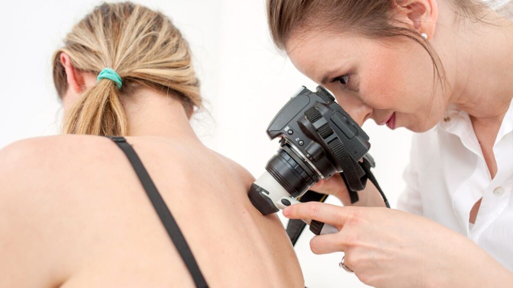 dermatologist taking a dermoscopy picture with a camera